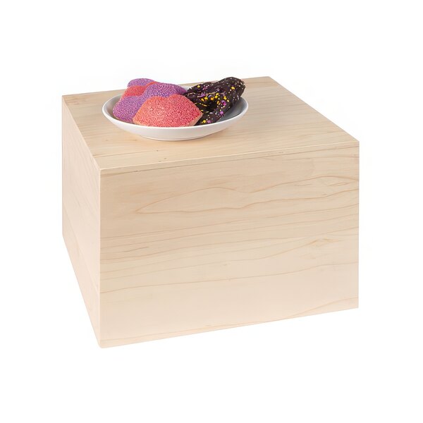 A plate of doughnuts on a Cal-Mil maple wood display riser.
