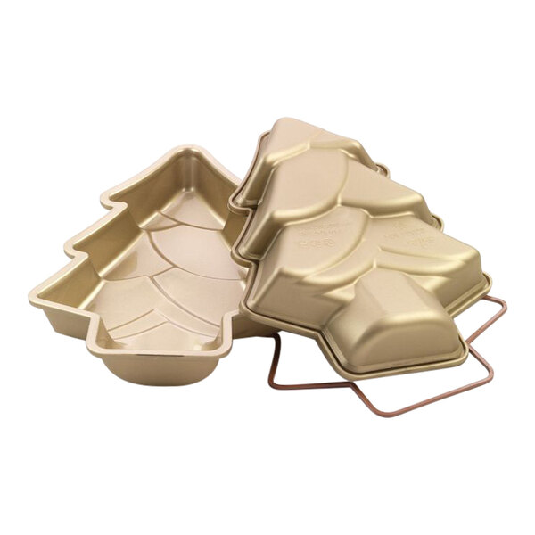 A white Silikomart silicone cake pan in the shape of a Christmas tree.
