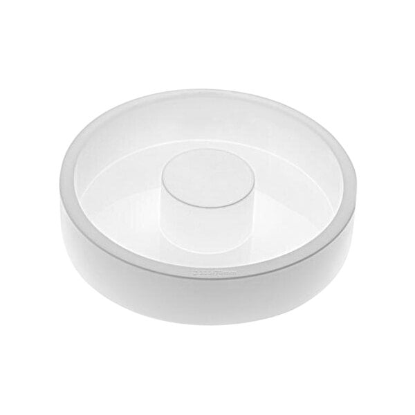 A white round silicone baking mold with a white cylinder on top with a black line.