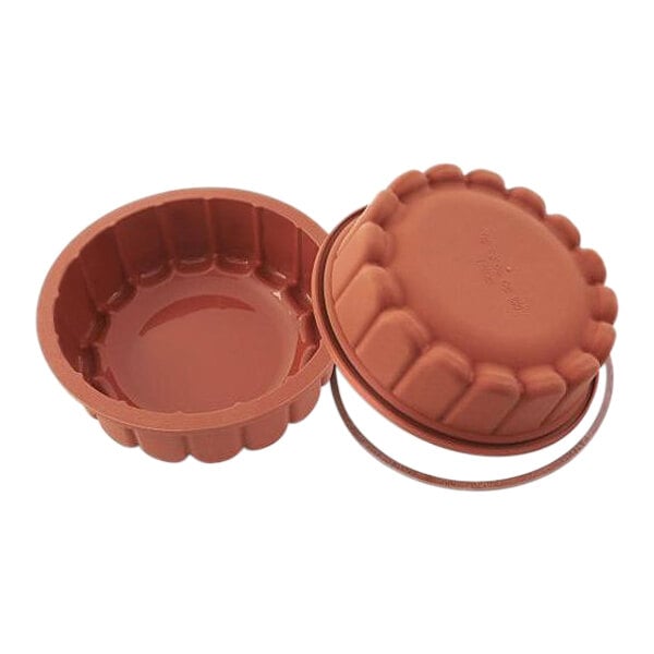 A brown silicone mold with a safety ring handle.