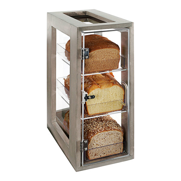 A glass display case with three shelves of bread.