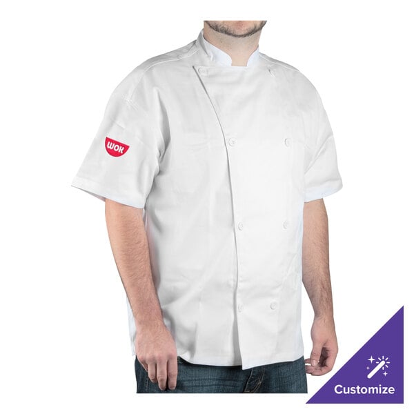 A man wearing a white Chef Revival chef jacket with a knife and steel.