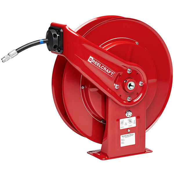 A red Reelcraft hose reel with a hose attached.