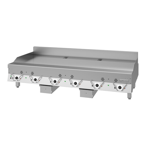 A large stainless steel electric griddle with multiple control knobs and a backsplash, designed for commercial kitchen use.
