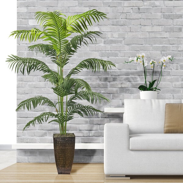 A LCG Sales artificial Areca palm tree in a copper planter.