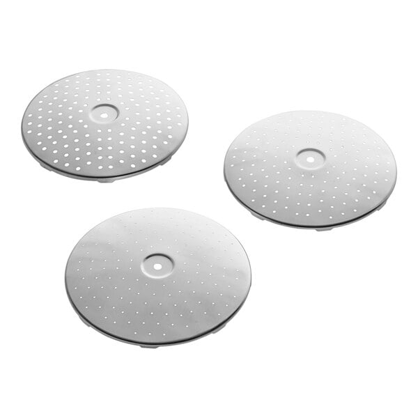 Three circular metal plates with holes in them.