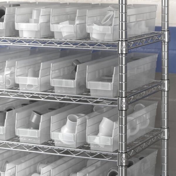 A metal rack with white Regency plastic bins.