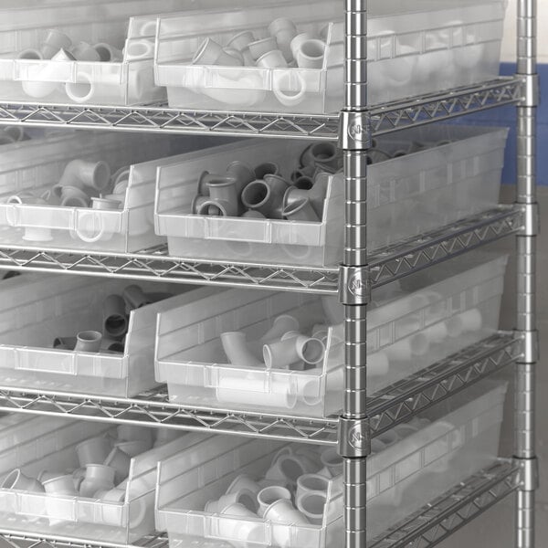 Regency clear plastic shelf bin on metal shelving