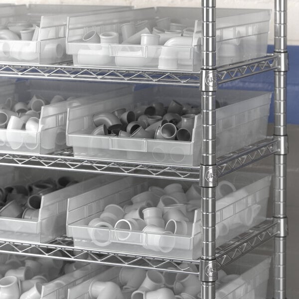 A white plastic Regency shelf bin on a metal shelf.