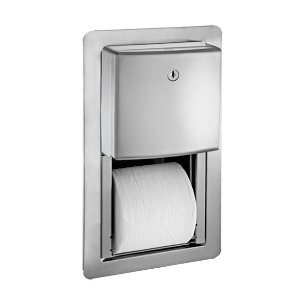 An American Specialties, Inc. stainless steel semi-recessed twin toilet paper holder with a roll of toilet paper.