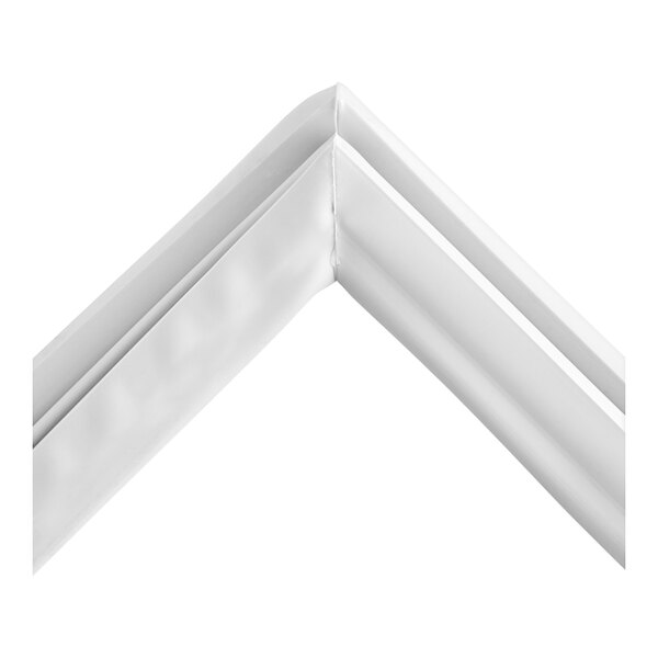A close-up of a white corner of a door gasket.