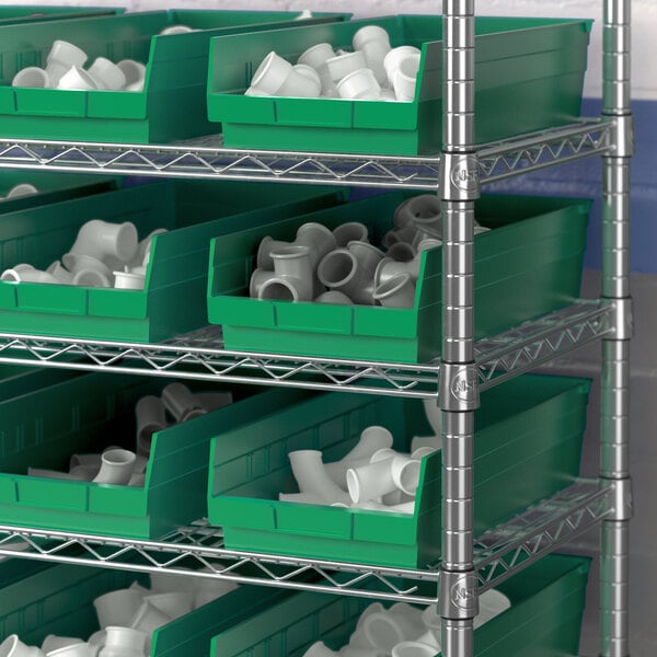 Metal shelving with green Regency shelf bins.