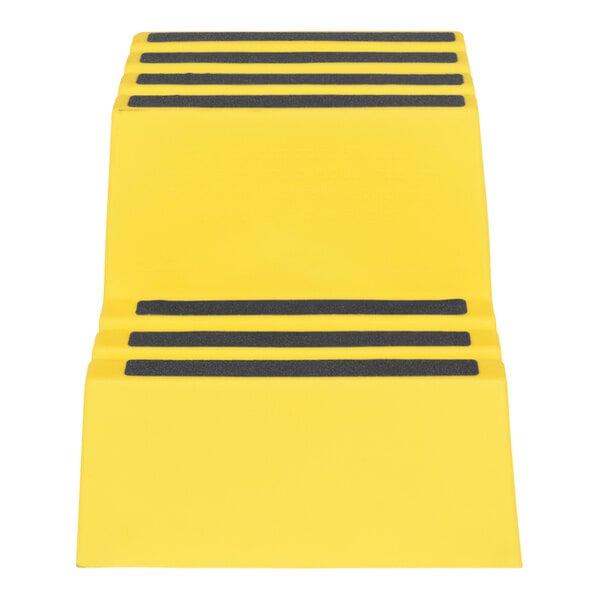 A yellow rectangular step stool with black stripes on the steps.