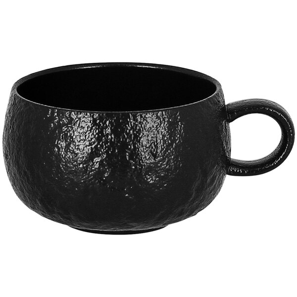 A black RAK Porcelain coffee cup with a handle.