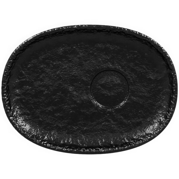 A black oval RAK Porcelain saucer with a circle in the middle.