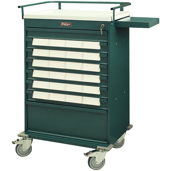 A green Harloff medication bin cart with white drawers on wheels.