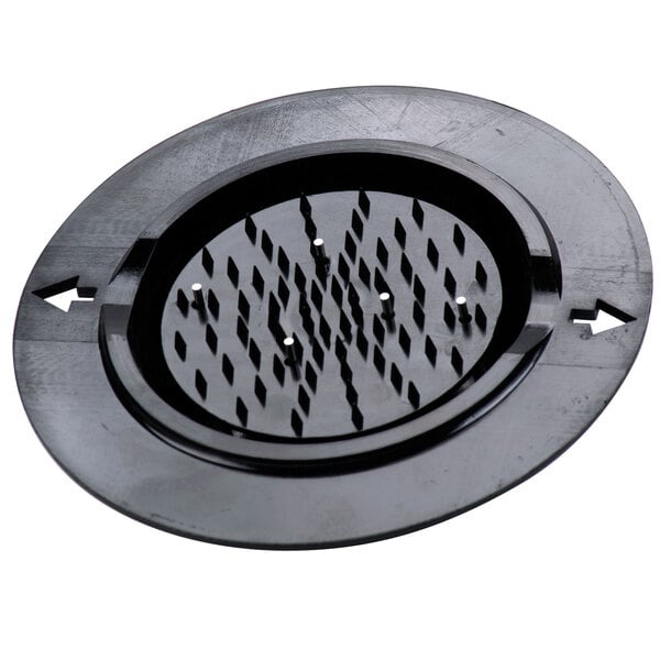 A black circular plastic guard with holes.
