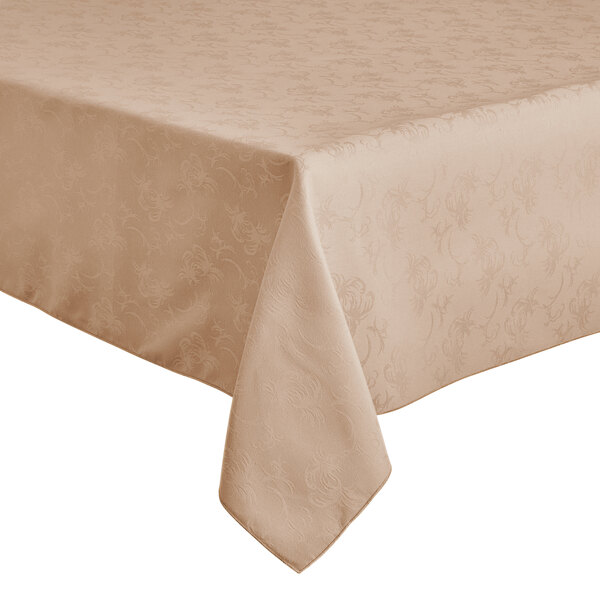 A Snap Drape Windsor Damask Sandalwood table cover with a floral pattern on a table.