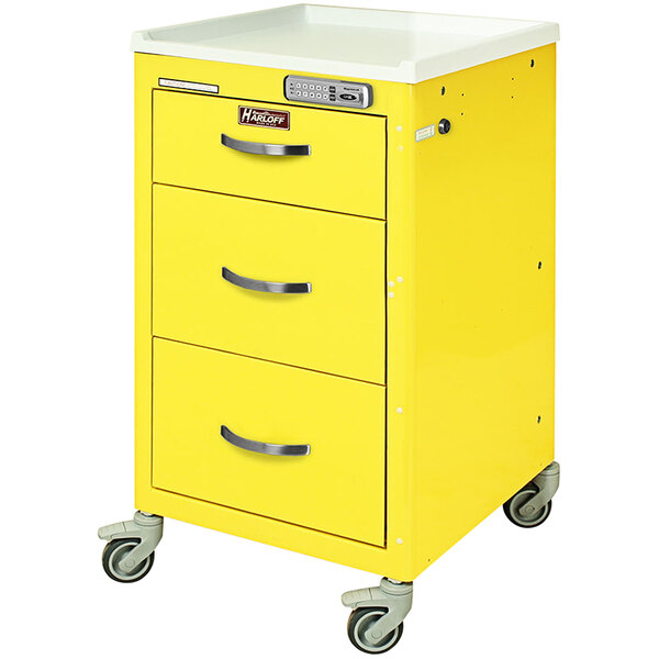 A yellow Harloff medical cart with three drawers.