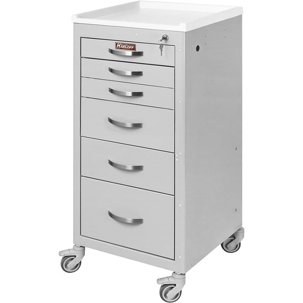 A gray Harloff medical procedure cart with 6 drawers and a key lock on wheels.