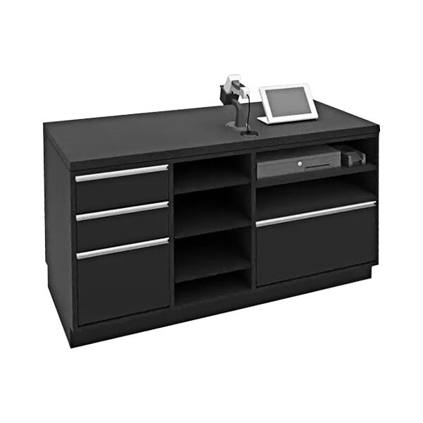 A black cash wrap retail counter with a tablet and a computer on top.