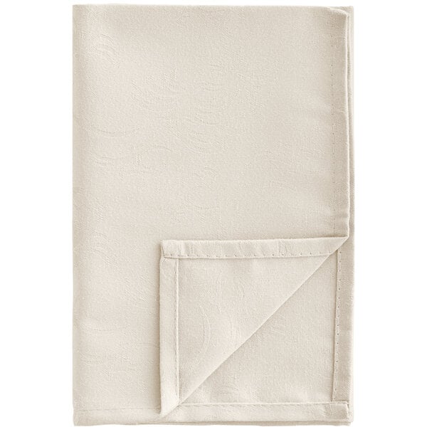 A white Snap Drape Windsor Damask cloth napkin with a stitched edge folded into a triangle.