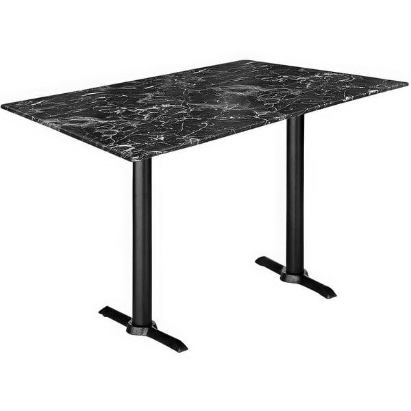 A black table with a black marble top and end column base.