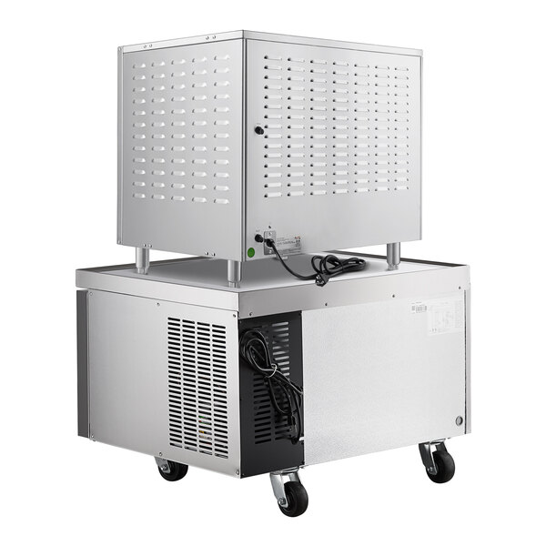 A large metal box with a white cabinet on wheels.