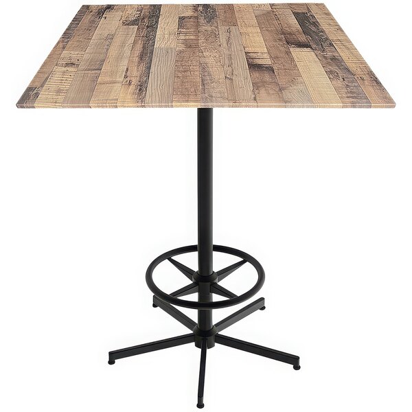 A Holland Bar Stool rustic wood table with a metal base.