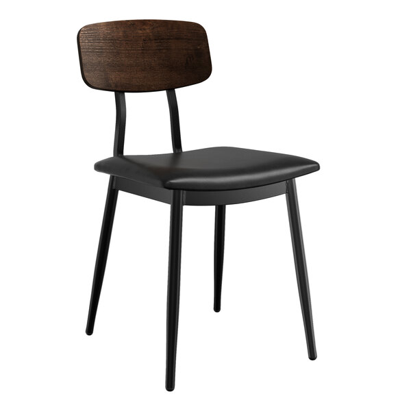 A Lancaster Table & Seating black restaurant chair with a black padded seat and wood backrest.