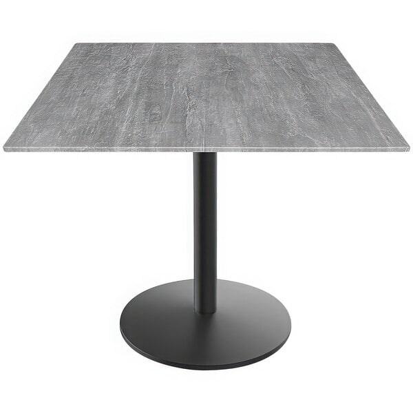 A Holland Bar Stool EuroSlim square table with a greystone top and black round base.