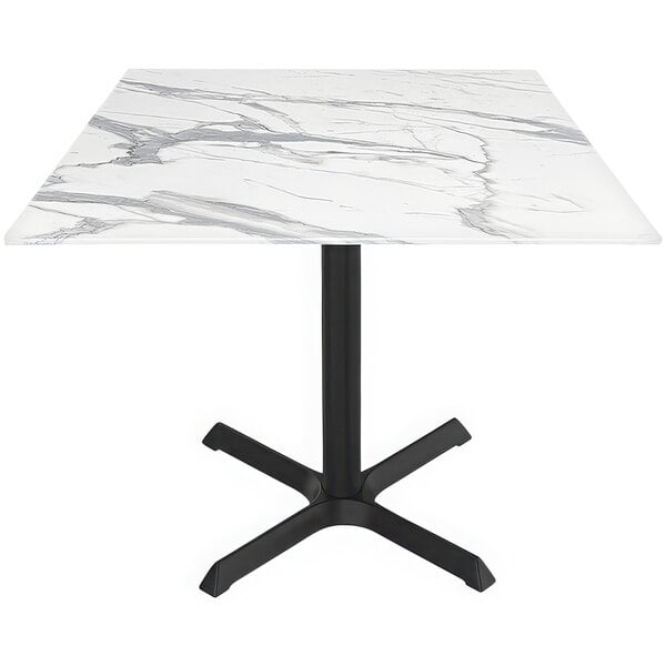 A white marble Holland Bar Stool table with a black cross base.