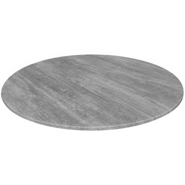 A grey circular table top on a white background.