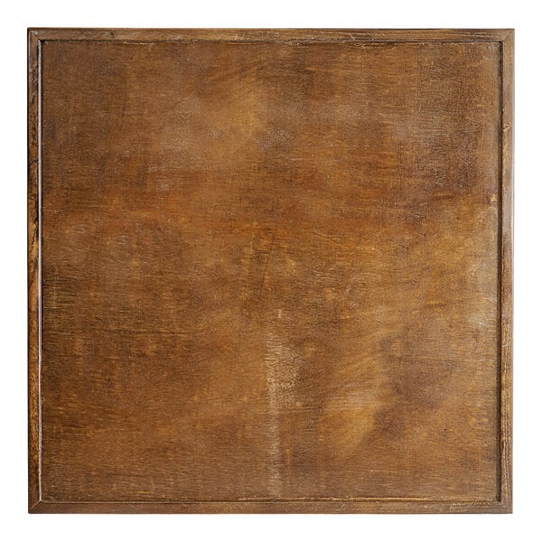 A Lancaster Table & Seating butcher block table with vintage finish.