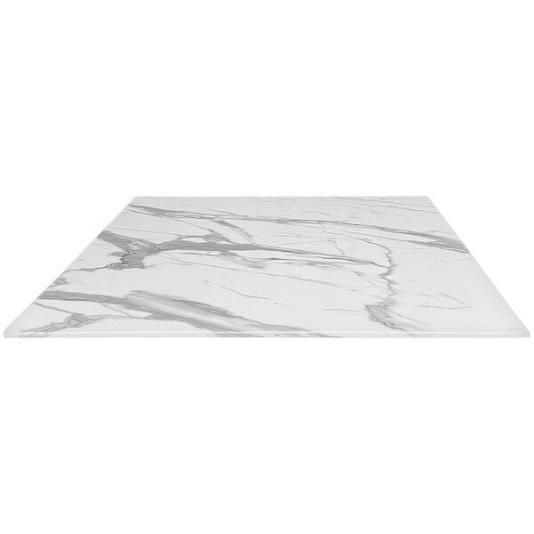 A white marble table top with black veins.