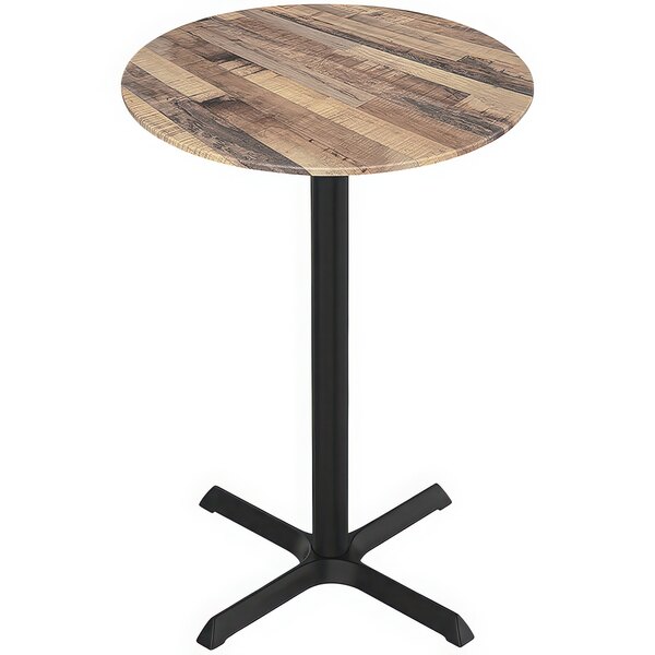 A close up of a Holland Bar Stool EuroSlim round wooden table with a black base.