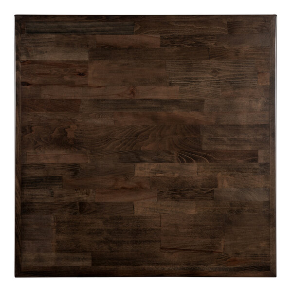 A Lancaster Table & Seating bar height table with a butcher block wood top in espresso finish.