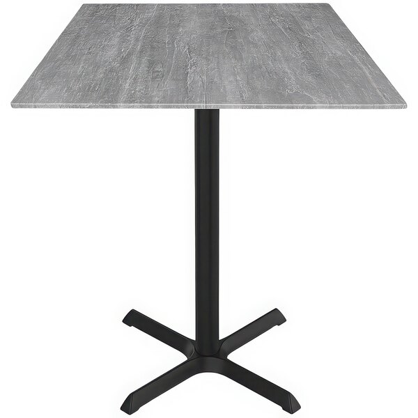 A Holland Bar Stool EuroSlim square table with a black cross base and grey top.