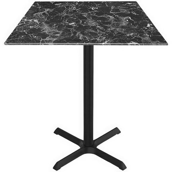 A black marble Holland Bar Stool table with a black metal base.