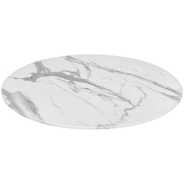 A Holland Bar Stool white marble round table top with grey veins.