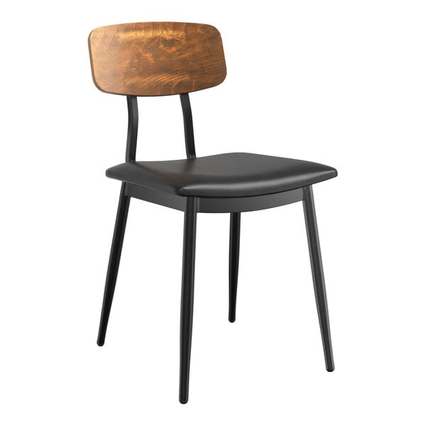 A Lancaster Table & Seating Mid-Century Black Chair with a Vintage Wood Backrest and Black Vinyl Seat.