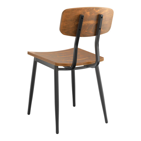 A Lancaster Table & Seating wooden chair with a backrest and black metal legs.