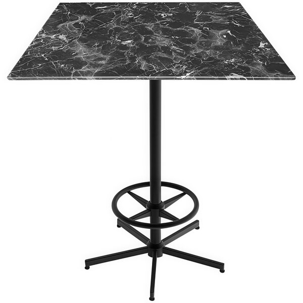 A Holland Bar Stool black marble table top with a metal foot rest base.