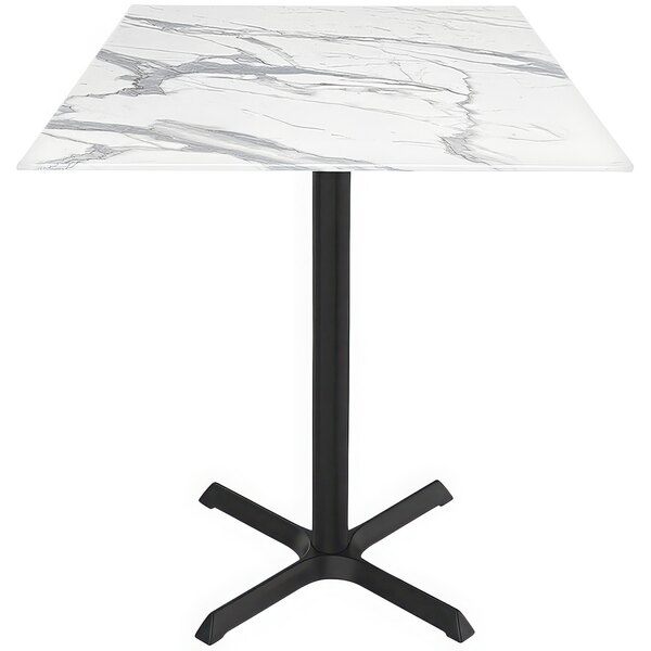 A white square table with a black base.