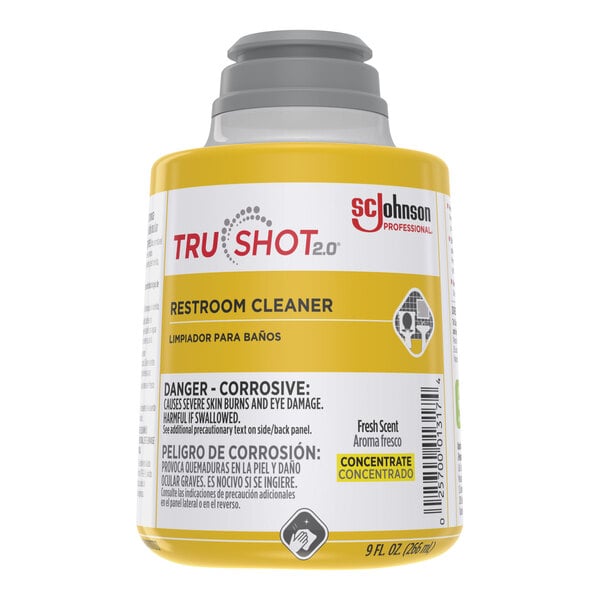 A close-up of a yellow and white SC Johnson Professional TruShot bathroom cleaner cartridge.