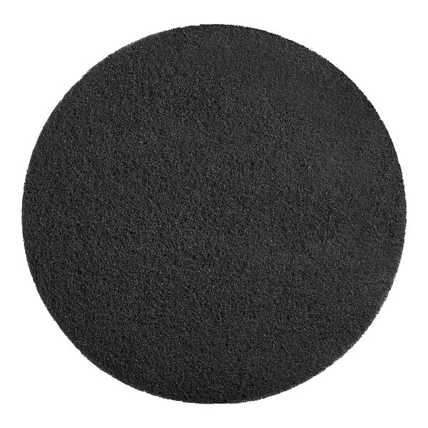 A black round SC Johnson Professional floor pad.