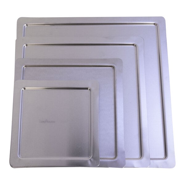 A group of rectangular metal plates with a square silver LloydPans Pizza Pan Separator lid on top.