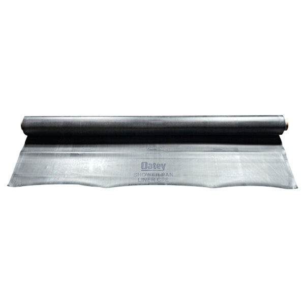 A roll of black plastic Oatey shower pan liner on a white background.