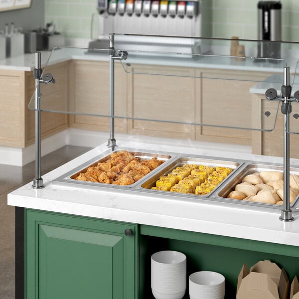 A ServIt drop-in hot food well on a counter with food in it.