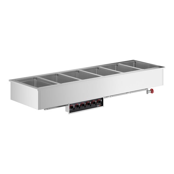 A stainless steel drop-in hot food well with six compartments and black and red knobs.